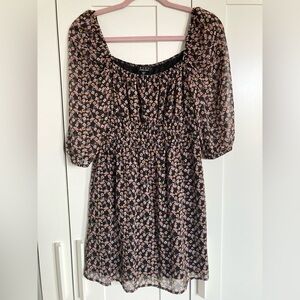 Trixxi black floral mini dress with square neck and sheer long sleeves. Size S